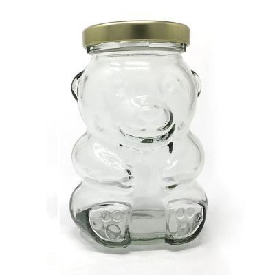 China Freshness Retention Bear Glass Jar With Gold /Black Lid for sale