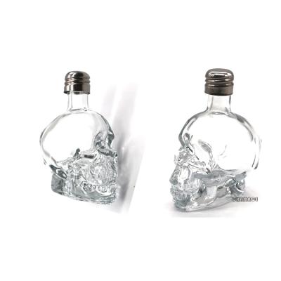 China Fancy 15ml 30ml 50ml 100ml Personal Care Frosted Clear Customized Colors Skull Glass Bottle With Screw Stainless Steel Lids for sale