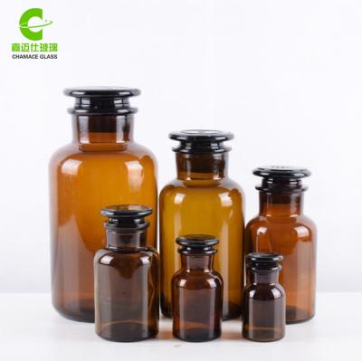 China 125ml Pharmaceutical Wide Mouth Amber Apothecary Glass Reagent Bottle With Glass Cap for sale