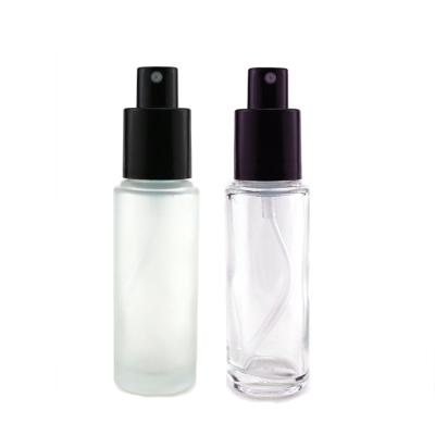 China 30ml Round Home Perfume Glass Bottle Cosmetic Clear Frosted Glass Lotion Cream Bottle With Press Pump Cap for sale