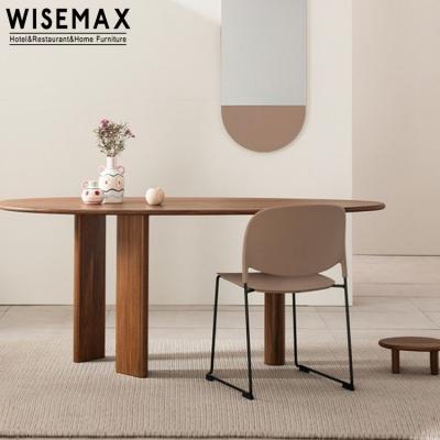 China WISEMAX FURNITURE Rattan Furniture Solid Wood Pebble Shape Triple Legs Modern Stable Unique Dining Table for sale