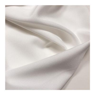 China 100d Woven Polyester Spandex Fabric With Elastic White Fabric For Trousers And Shirts Te koop