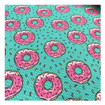 China Spandex Knitted Jacquard Fabric Blend Bubble Cloth Digital Printing Dress Pajama Fabric Te koop