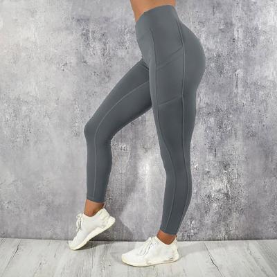 China Wholesale Breathable Pocket High Waisted Yoga Pants Solid Color Hip Sports Tight Fitness Workout Woman Leggings for sale