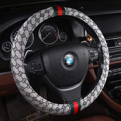 China Winter Use Car Steering Wheel Cover Four Seasons Personality Universal Fashion Car Non-slip Canvas Material Accessory for sale