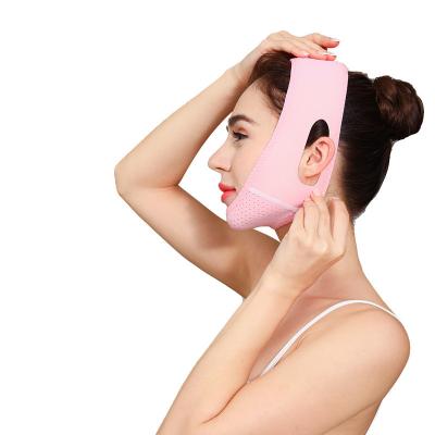 China Adjust Size Double Adjustable Facial V Shape Chin Reducer Lift Pink Neoprene Cloth Bandage For Slimming for sale