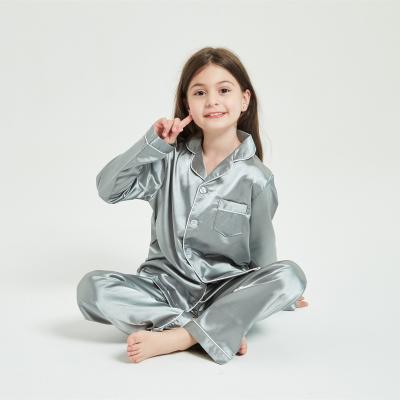 China Wholesale QUICK DRY Solid Color Unisex Kids Button Sleepwear Silky Satin Pajamas Sets for sale