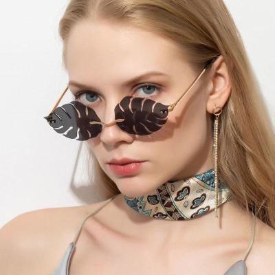 China Cool Custom Glasses Rimless Shade Eyewear Men Women Sunglasses Newest Party Shape Metal Leaves Personality Sun Glasses Custom Glasses for sale