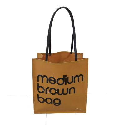 China Fashionable Durable PVC Hand Tote Bag Shiny Medium Brown Shopping Bag With Large Capacity for sale