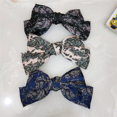 China Fashion dark floral slip printing big bow spring clip hairpin ladies headdress wholesale for sale