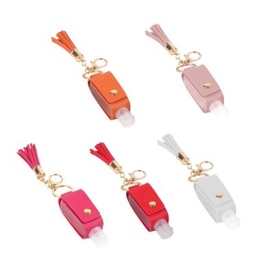 China Tassel Decoration Portable Leather Hand Sanitizer Bottle Holster Customized Key Chain for sale