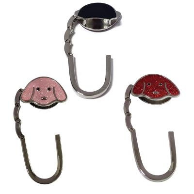 China Fashion Factory Custom Portable Cute Dog Head Shape PU And Zinc Alloy Folding Bag Hanger for sale