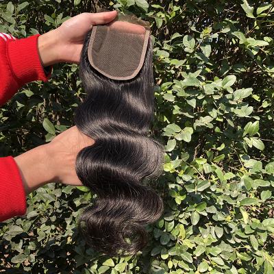 China Cheap Brazilian Virgin Body Wave Hair Bundles 4*4 Body Wave Lace Closure With Baby Hair for sale