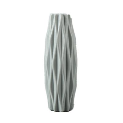 China Creative camellia ornaments from direct-selling manufacturer of color minimalist plastic vases Nordic vases dry and wet flower vases for sale