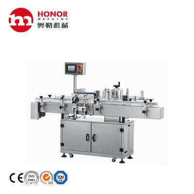 China Food Honor Machine Water Juice Soft Drink Bottle Double Side Adhesive Sticker Labeling Machine for sale