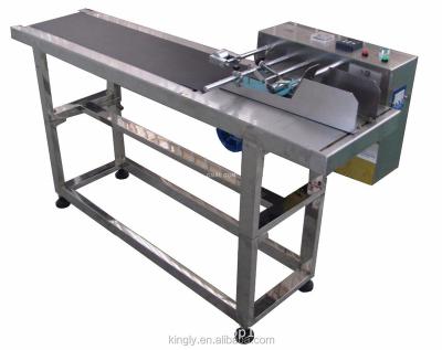 China Newest Beverage Friction Feeder Automatic Paging Machine To Code Machine for sale