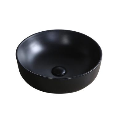 China 2022 New Designer Chinese Countertop Bathroom Modern Black Table Ceramic Wash Basin for sale