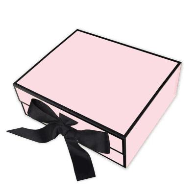 China Handmade Personalized Pink Cosmetic Foldable Paper Gift Box Cardboard Magnetic Makeup Display Box With Ribbon for sale