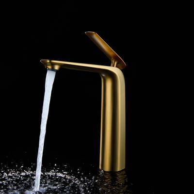 China Contemporary Hot and Cold Faucets Water Metered Deck Mounted Gold Waterfall Mess Wash Mixer Tap Bathroom Basin Faucet for sale