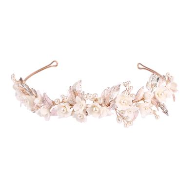 China 2021 Hot Alloy Fashionable White Ceramic Wedding Flower Hair Bands For Women Bridal Boda Tiaras Hair Band for sale