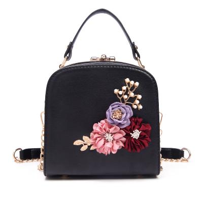 China 2021 fashion design embroidery flowers metal cut long chain women PU ladies leather handbags to shoulder handbags for sale