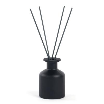 China 150ml cosmetic Matte Black Colored Round Empty Reed Diffuser Glass Bottle With Cork Stopper for sale