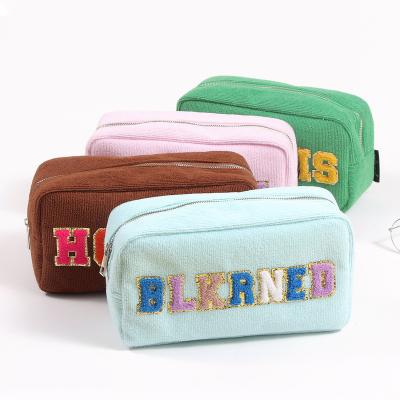 China Fashion Makeup Bags Terry Cosmetic Bag With Letter Patches Accept OEM Accessories Organizer Woman Cosmetic Makeup Bag for sale