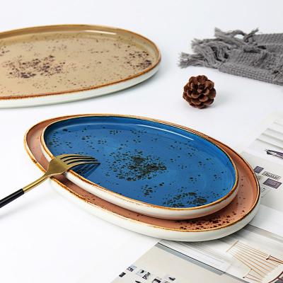 China Sustainable Custom Rustic Vintage Ceramic Dinner Trays Bread Charger Dish Spotted Oval Dinner Dish for sale