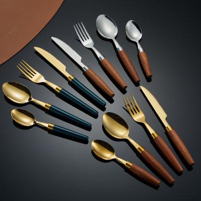 China Sustainable 304 stainless steel dining round head  creative chinese style wooden handle soup spoon fork steak knife cutlery set for sale