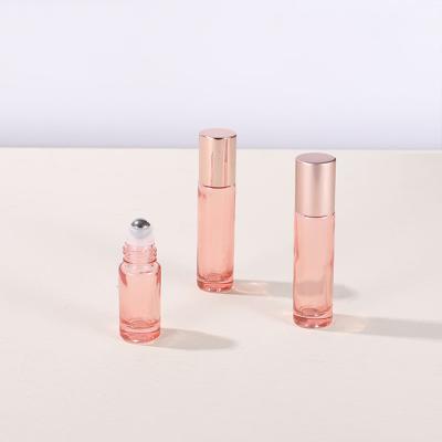 China Custom Empty Perfume Bottle Personal Care 5ml 10ml Rose Gold Clear Pink Roll On Glass Bottles For Essential Oils for sale