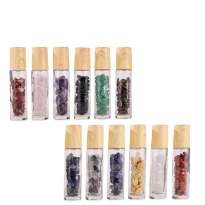 China Recyclable Custom Cosmetic Packaging 10ml Transparent Round Glass Gemstone Essential Oils Roll On Bottle With Bamboo Lids Silver Cap for sale