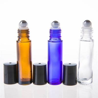 China Clear 10ml Amber BlueGlass Essential Oil Roller Cosmetic Bottles With Plastic Cap for sale