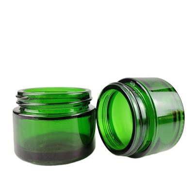 China 20g 30g 50g 60g 100g Amber Blue Green Clear Round Cosmetic Shape Glass Jar Jars Glass Jar For Candle for sale