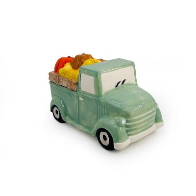 China Cute Shape Design Storage Harvest Festival Truck Decoration Cartoon Pumpkin Truck Ceramic Jar for sale