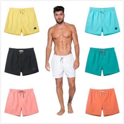 China QUICK DRY custom design quick dry men's beach shorts 20 colors solid swim trunks fashion new styles men's swim shorts for sale