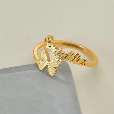 China Hiphop Gold Plated Butterfly Name Ring Personalized Custom Initial Nameplate Frosted Jewelry For Women Stainless Steel Adjustable Rings for sale