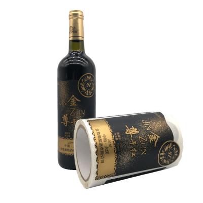 China Environmental friendly custom gold foil embossed sticker waterproof custom self-adhesive red wine liquor bottle printing label for sale