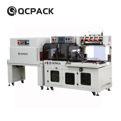 China CLOTHING Electric Shrink Tunnel Film Shrink Wrapping Cutting And Wrapping Candy Machine for sale