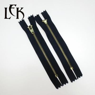 China LEK Bulk 5# 4# 3# Auto Lock Gun Half Brass Half Auto Lock Jeans Custom Metal Zipper for sale