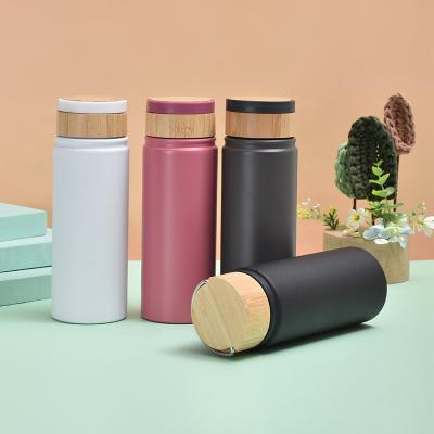 China PORTABLE 304 stainless steel thermos cup wood grain cover straight drinking vacuum straight cup outdoor mountaineering with handy cup for sale