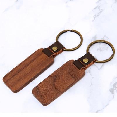 China Customized High Quality Walnut Wood Engraving Wood Laser Engrave Logo Wooden Blank Wood Keychains For DIY Craft for sale