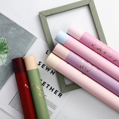 China Peng Fa Popular Waterproof Gift Wrapping Letters Flower Wrapping Paper Plastic Waterproof Size 58*58cm for sale