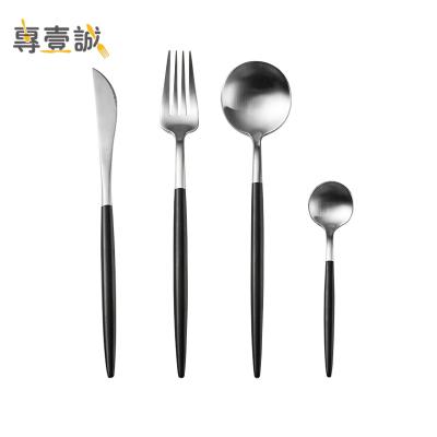 China Sustainable 4pcs Metal Cutlery Set With Black White Handle Stainless Steel Reusable Cutlery for sale