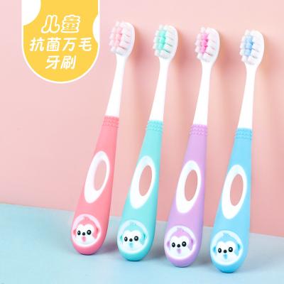 China Cartoon No.128 Small Bristle Brush Kids Cartoon Soft Silicone Head Toothbrush Round Non Slip Handle Brush for sale