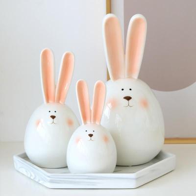 China Modern Wholesale Handmade Porcelain Easter Day Bunny Figurines for Home Decoration Ceramic Rabbit Bunny Statue for sale