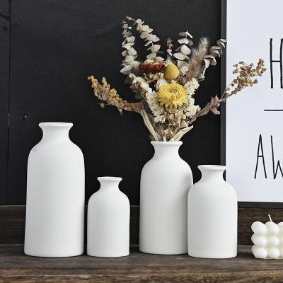 China Modern INS Pottery Vase Wind Creative Home Living Room Decoration Table Vase Flower Arrangement Dried Flower White Ceramic Vase for sale