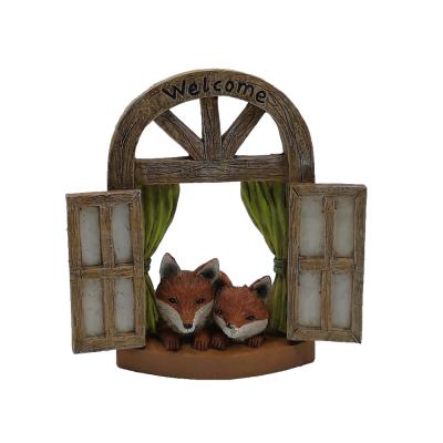 China Custom Made Eco-Friendly Garden Decoration Mini Resin Gnome Fairy Door With Two Welcome Foxes for sale