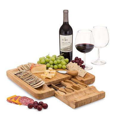 China Sustainable bamboo cheese board set with four sets of knives and multifunctional cheese boardSquare drawer for sale