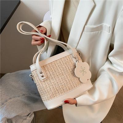 China Foreign style fresh launched new design shoulder bag summer new fresh and sweet bucket lady's straw beach small handbag for sale