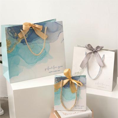 China Hot Sale Recyclable Customized Paper Gift Bags Packaging Cheap Gift Bags With Gold Foil for sale